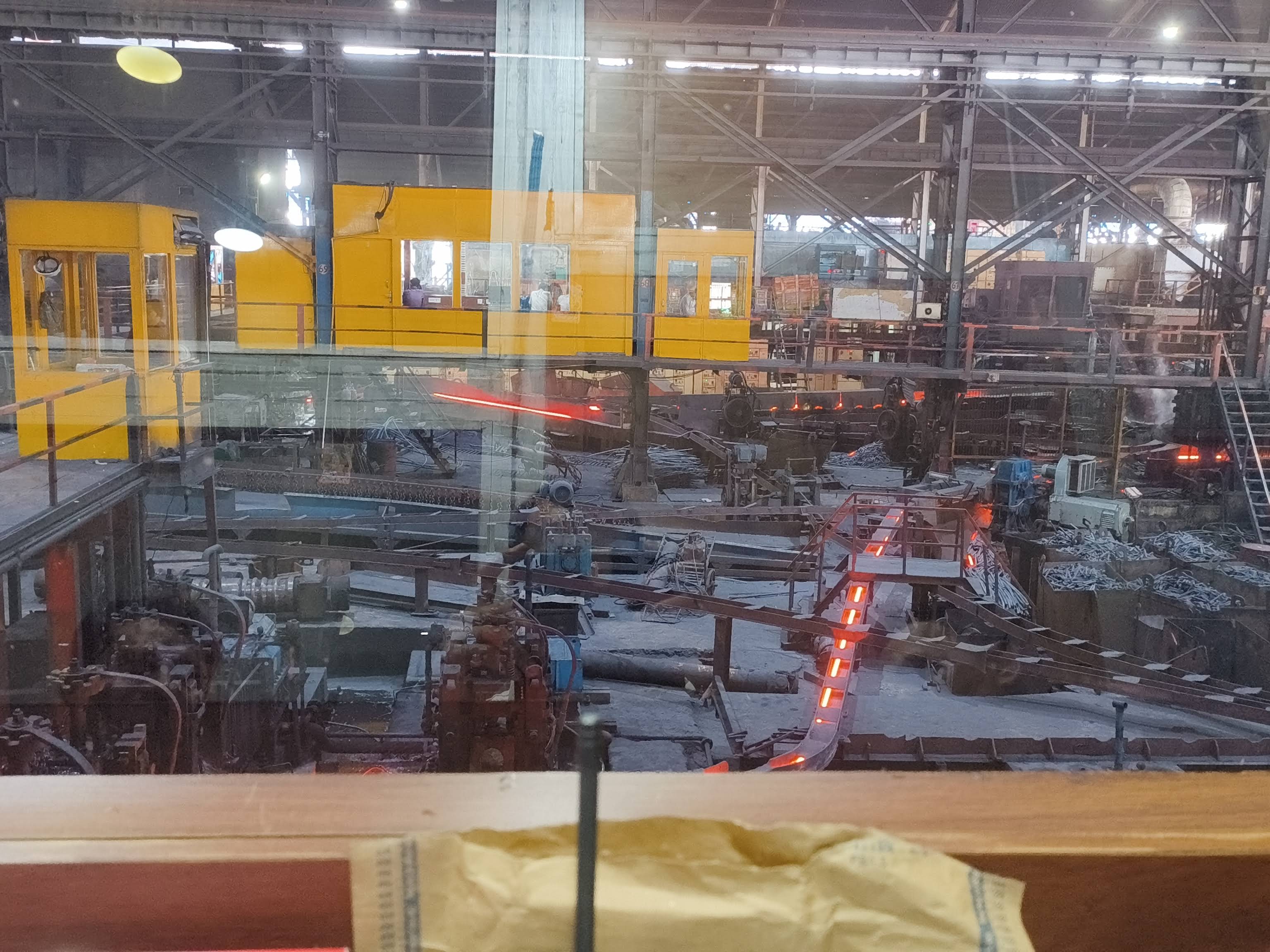 Factory control room and rolling process through glass
